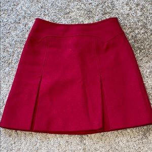 Red pleated skirt
